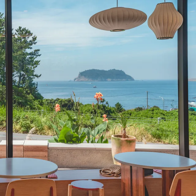 Inside the bakery café, with the sea and an island through the windows